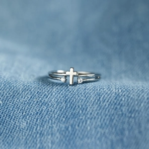 Minimalist S925 sterling silver cross open ring with sparkling zircon on denim fabric