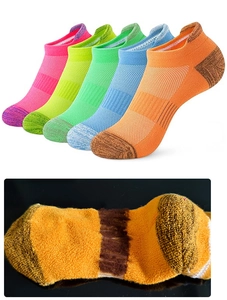 Close-up of thick terry knit texture and five colorful athletic low cut cotton socks