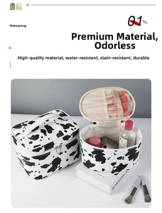 Detail view of cow print makeup bag set with waterproof fabric and brush slots