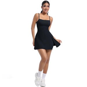 Close-up of black athletic dress with spaghetti straps and side slit hem detail