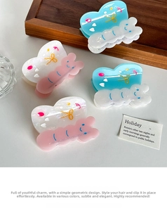 Set of four sweet butterfly hair clips in pastel pink and blue with pearlescent finish