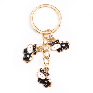 Cartoon cow alloy keychain with three enamel charms and golden metal ring for bags