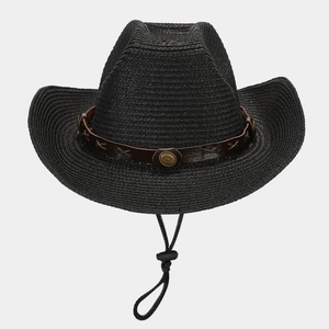 Detail of black straw cowboy hat featuring brown leather band with gold metal studs