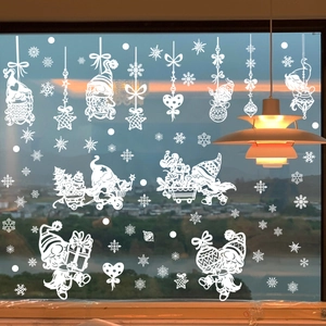 White Christmas window decals featuring gnomes, snowflakes and hanging balls on glass