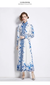 Detail of blue and white floral dress with stand collar and hollow lace hem decoration