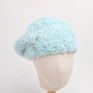 Detail of light blue faux fur beret featuring elegant silver bead embellishments
