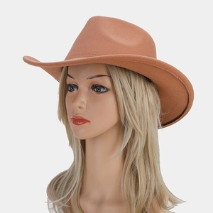Detail of terracotta wool felt western cowboy hat with a wide brim and classic pinched crown