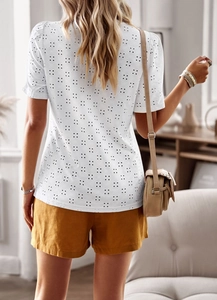 Back view of white eyelet embroidery short sleeve top with delicate dot cutouts