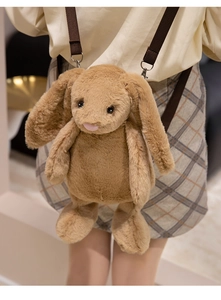 Detail of soft brown plush bunny bag showing long ears and adjustable fabric strap