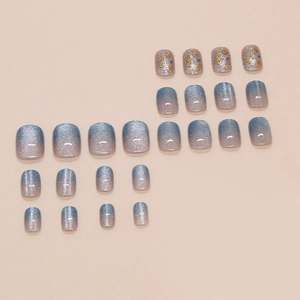 Blue cat-eye gradient press-on nails with glitter and gold accents, 24-piece full set