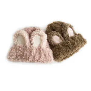 Fuzzy knit beanies with plush rabbit ears in pink and brown, warm winter headwear