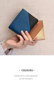 Close-up of contrast color bi-fold wallets with cross-grain leather texture in hand