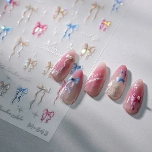 3D holographic bow and star nail art stickers with butterfly designs on gradient pink nails
