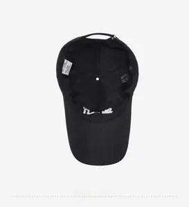 Detail of the black cotton baseball cap interior showing sweatband and adjustable metal buckle