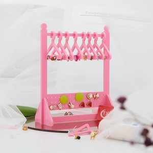 Pink acrylic jewelry display stand with hanger design for earrings and necklaces