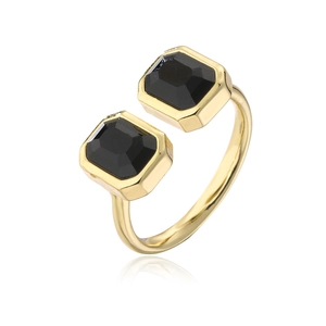 Close-up of gold-plated open ring featuring two black rectangular cubic zirconia stones