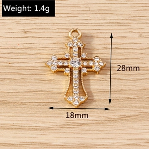 Detailed view of rhinestone cross pendant with dimensions 28mm x 18mm and 1.4g weight