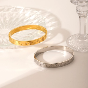 Star-patterned stainless steel bangles with diamonds in gold and silver finish