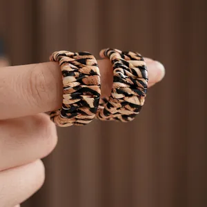 Retro C-shaped leopard print leather woven earrings with a stylish vintage aesthetic