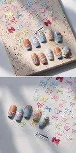 Macro detail of 3D embossed nail stickers featuring macaron bows and heart designs