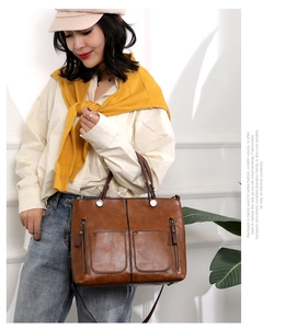 Brown large capacity PU tote bag with dual exterior zippers and retro design details