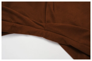 Detail view of the twisted waist design on brown high waist straight leg sweatpants