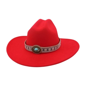 Close-up of red felt cowboy hat with ethnic embroidered ribbon and turquoise stone detail