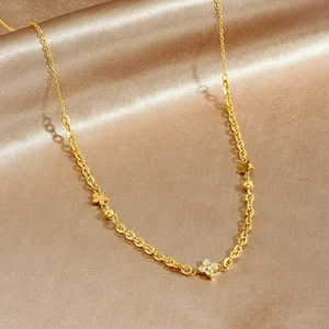 Minimalist gold-plated stainless steel chain necklace with clover charms and CZ crystals
