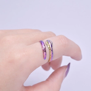 Macro detail of snake ring featuring colorful iridescent plating and scale texture