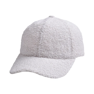 Close-up detail of the white faux lamb wool baseball cap texture for winter fashion