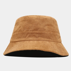 Detailed view of camel corduroy bucket hat with contrasting black inner lining and soft texture