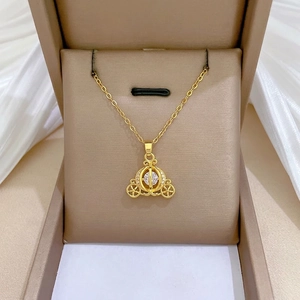Elegant gold titanium steel necklace with a diamond-encrusted pumpkin carriage pendant