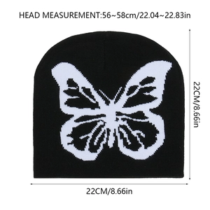 Tableau détaillé des tailles du bonnet noir en tricot avec motif papillon blanc