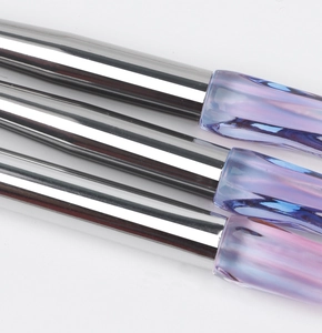 Detail of eyeshadow brushes with silver metal ferrules and crystal-cut purple handles