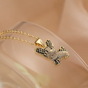Gold plated dog pendant necklace with sparkling cubic zirconia on a minimalist chain