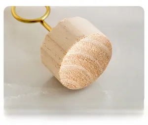 Detail of light luxury metal ginkgo leaf ornament with wooden base and gold metal ring
