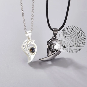 Macro view of projection stone showing I Love You in 100 languages for couple necklaces