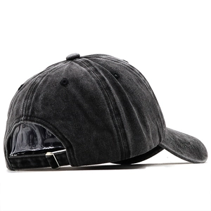 Rear view of a washed dark grey denim baseball cap with an adjustable metal strap buckle
