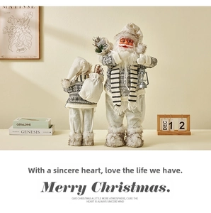 Detail of Nordic Santa Claus figurines in grey knit outfits with silver lanterns