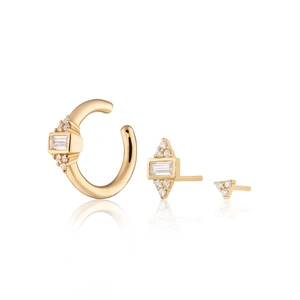 Macro shot of three-piece gold plated silver earring set with sparkling zircon gemstones