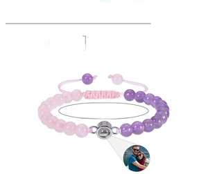 Detail of adjustable woven bracelet with rose quartz, amethyst and custom photo projection stone