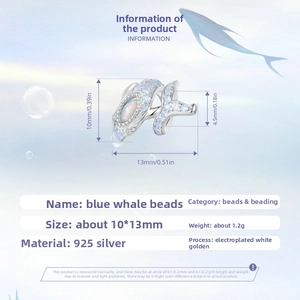 Detail view of S925 sterling silver blue whale charm with opal and cubic zirconia