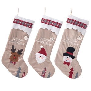 Three-piece set of linen Christmas stockings with Santa, reindeer and snowman embroidery