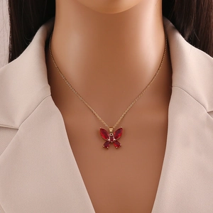 Elegant gold-tone stainless steel necklace featuring a vibrant red butterfly pendant