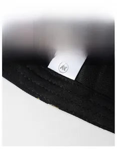 Detail of widened sweatband and clean stitching inside the black baseball cap