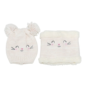 Close-up of pink knit hat with pom-poms and matching cat embroidery faux fur neck warmer