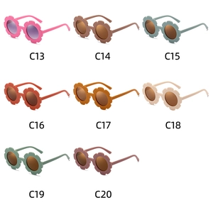Detail view of flower-shaped kids sunglasses in eight trendy colors with model codes