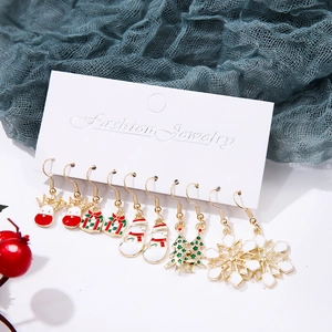 Detailed close-up of a 6-pair Christmas earring set with reindeer and snowflake motifs