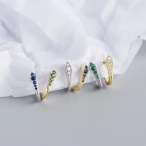 Detailed view of three pairs of S925 silver snake earrings with colorful zircon stones