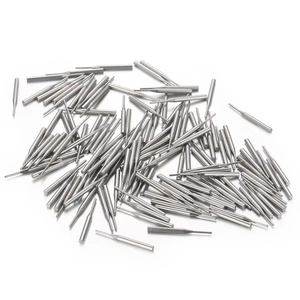 Bulk precision stainless steel dowel pins and hardware components on white background